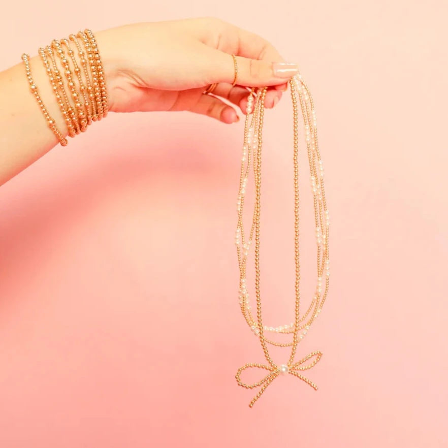 Beaded Blondes | Gold Bow Necklace with Pearl Accent - preenteronline